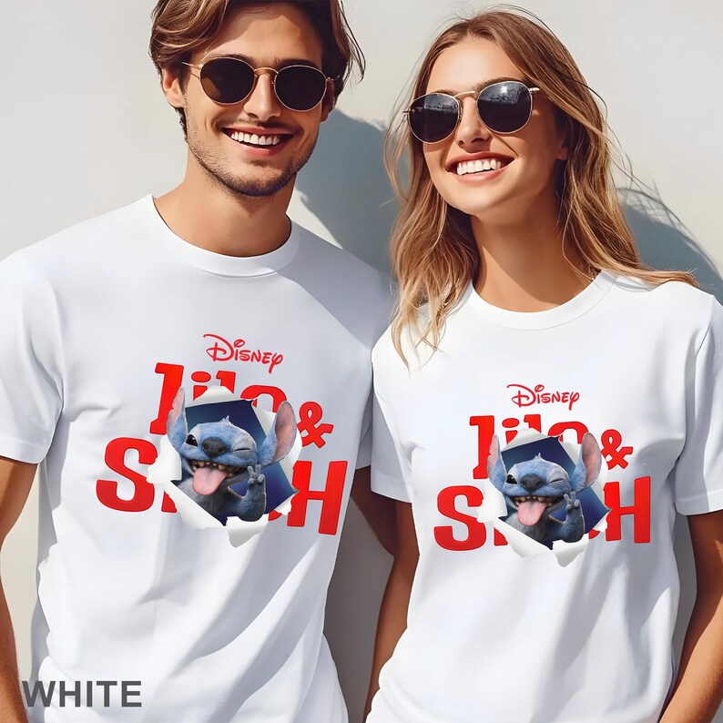 May include: White t-shirts featuring a Disney Lilo & Stitch design. The graphic shows Stitch popping out of a torn paper effect, with the Disney logo above. The text "Lilo & Stitch" is in red. The word "WHITE" is at the bottom.