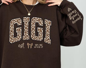 Custom Leopard Gigi Sweatshirt With Grandkids Names On Sleeve, Personalized Gigi Sweatshirt, Gift For Gigi, Christmas Gift, Gigi Est Sweater