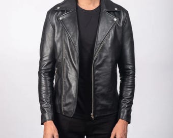 May include: A black leather jacket with a classic biker style. The jacket features a notched collar, asymmetrical zipper closure, and zippered pockets. The sleeves are long and fitted, and the jacket appears to be made of high-quality leather.