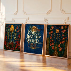 May include: Three framed wall art prints featuring stained glass style designs. The left shows skeletons among red roses, the center displays the text O dry bones, hear the WORD of the Lord! Ezekiel 37:4, and the right depicts skeletons near orange roses.