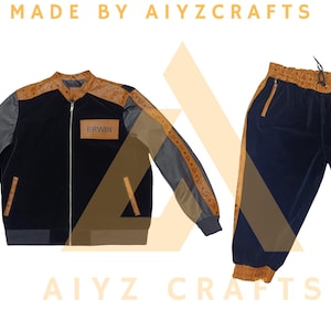 May include: A black and brown track suit set. The jacket has gray sleeves and brown accents, with the name "ERWIN" on a patch. The pants are navy blue with brown accents. The text "MADE BY AIYZCRAFTS" is at the top and bottom.