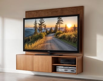 May include: A wooden wall-mounted entertainment center with a flat-screen TV displaying a scenic landscape image. The unit features two cabinet doors and an open shelf for storage.