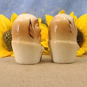 Right side view Vintage Bald Man Salt and Pepper Shakers Hand Painted - Unmarked, though maybe from Japan. From the 50s, they are in near mint condition with both stoppers. They are 3 inches high by 1.83 inches wide with no crazing.