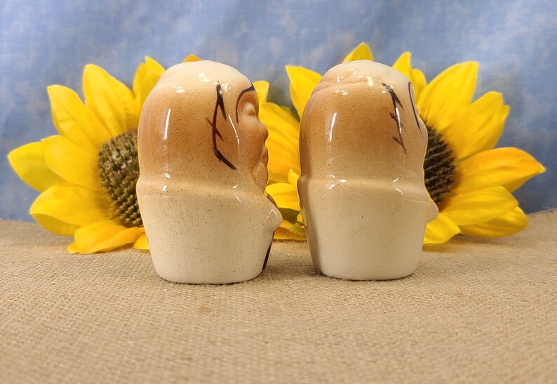 Right side view Vintage Bald Man Salt and Pepper Shakers Hand Painted - Unmarked, though maybe from Japan. From the 50s, they are in near mint condition with both stoppers. They are 3 inches high by 1.83 inches wide with no crazing.