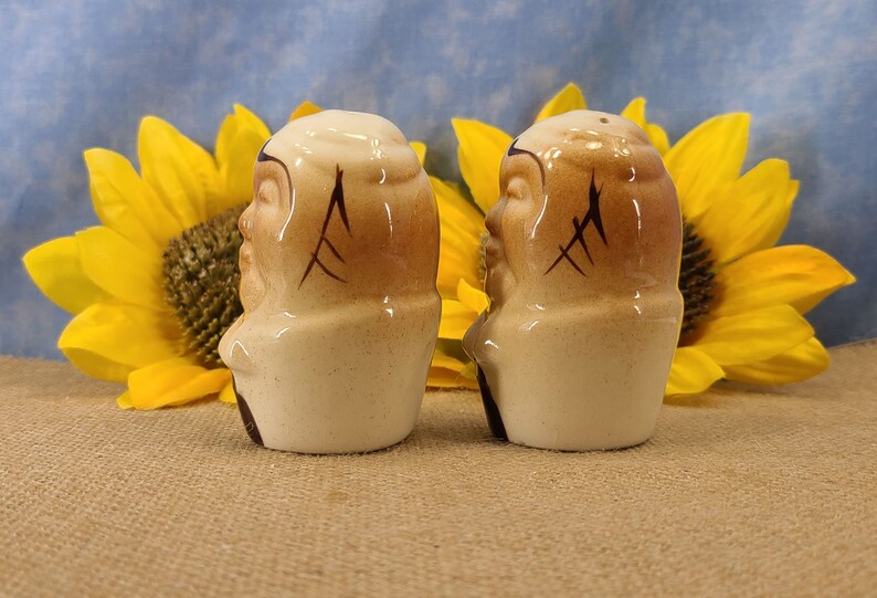 Left side view Vintage Bald Man Salt and Pepper Shakers Hand Painted - Unmarked, though maybe from Japan. From the 50s, they are in near mint condition with both stoppers. They are 3 inches high by 1.83 inches wide with no crazing.