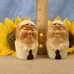 Vintage Bald Man Salt and Pepper Shakers Hand Painted - Unmarked, though maybe from Japan. From the 50s, they are in near mint condition with both stoppers. They are 3 inches high by 1.83 inches wide with no crazing.