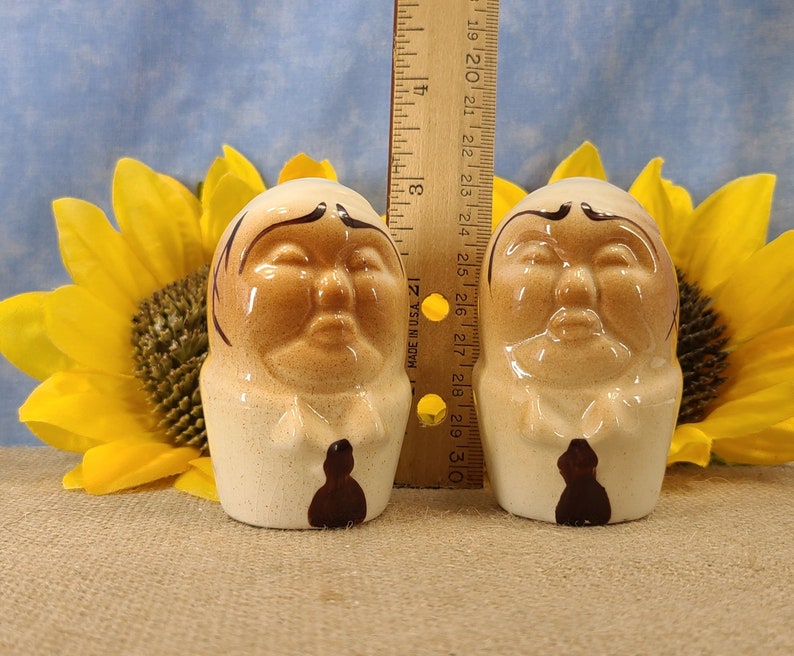Vintage Bald Man Salt and Pepper Shakers Hand Painted - Unmarked, though maybe from Japan. From the 50s, they are in near mint condition with both stoppers. They are 3 inches high by 1.83 inches wide with no crazing.