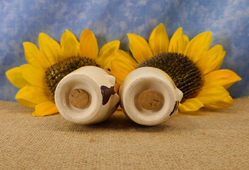 Bottom view of Vintage Bald Man Salt and Pepper Shakers Hand Painted - Unmarked, though maybe from Japan. From the 50s, they are in near mint condition with both stoppers. They are 3 inches high by 1.83 inches wide with no crazing.