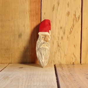 Santa Christmas ornament had carved basswood