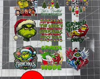 May include: A collection of nine colorful Grinch-themed stickers featuring various illustrations of the character, including text such as Whoville Est. 1954, I'm a Grinchaholic, Grinch Vibes Only, Merry Grinchmas, and Grinch Mode, arranged on a grid mat.