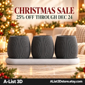 May include: Three dark gray, vertically ribbed, rounded planters sit on a light gray, oval-shaped tray. The image includes the text CHRISTMAS SALE 25% OFF THROUGH DEC 24, A-List 3D, and AList3Dstore.etsy.com, with a blurred holiday background.