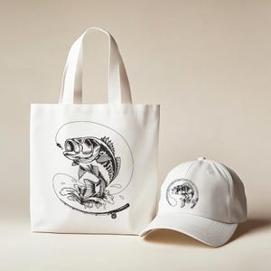 May include: White tote bag and baseball cap featuring a black and white illustration of a largemouth bass jumping out of the water, with a fishing rod and line. The tote bag has a rectangular shape with two handles. The baseball cap has a curved brim.