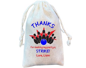 May include: A white burlap favor bag with a bowling theme. It says "THANKS for making my party a STRIKE! Love, Liam".