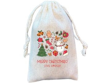 May include: A white cotton drawstring bag with a Christmas design featuring a snowman, gingerbread man, candy canes, and a Christmas tree. The bag has the text "Merry Christmas! Love, Lyndsey" printed on it.