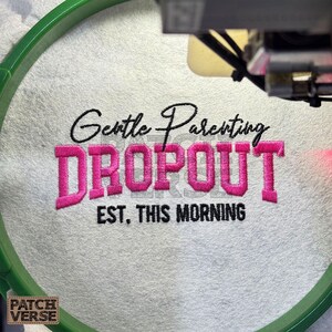 Gentle Parenting Dropout flat embroidery machine design featuring bold varsity lettering with script overlay stitched on a hat hoop setup. Funny mom life cap embroidery file perfect for dad hats, snapbacks and trucker hats. Digital embroidery design available in PES DST EXP VP3 HUS JEF XXX SEW formats for clean professional hat embroidery production..