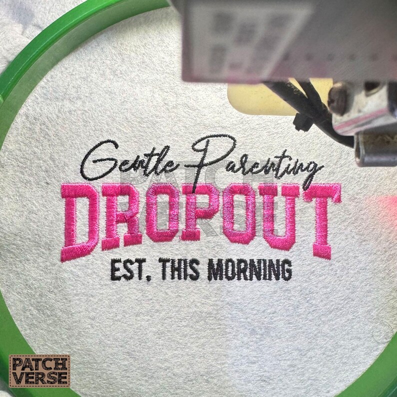 Gentle Parenting Dropout flat embroidery machine design featuring bold varsity lettering with script overlay stitched on a hat hoop setup. Funny mom life cap embroidery file perfect for dad hats, snapbacks and trucker hats. Digital embroidery design available in PES DST EXP VP3 HUS JEF XXX SEW formats for clean professional hat embroidery production..