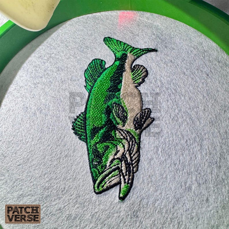 Bass fish embroidery design file stitched in a realistic largemouth bass style, professionally digitized for hats and caps. This fishing embroidery file is optimized for dad hats, trucker hats, and snapback caps, featuring clean outlines and smooth fills for outdoor, angler, and fishing brand projects. Perfect for machine embroidery on fishing hats, custom caps, and 
outdoor apparel.