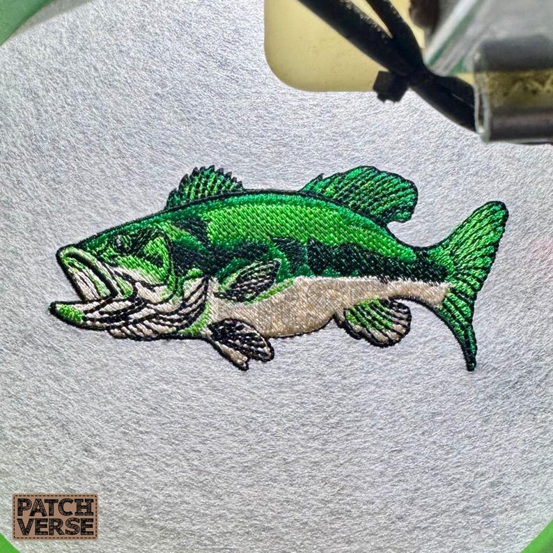 Bass fish embroidery design file stitched in a realistic largemouth bass style, professionally digitized for hats and caps. This fishing embroidery file is optimized for dad hats, trucker hats, and snapback caps, featuring clean outlines and smooth fills for outdoor, angler, and fishing brand projects. Perfect for machine embroidery on fishing hats, custom caps, and 
outdoor apparel.