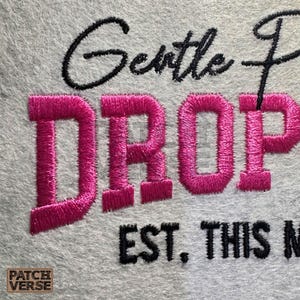 Gentle Parenting Dropout flat embroidery machine design featuring bold varsity lettering with script overlay stitched on a hat hoop setup. Funny mom life cap embroidery file perfect for dad hats, snapbacks and trucker hats. Digital embroidery design available in PES DST EXP VP3 HUS JEF XXX SEW formats for clean professional hat embroidery production..