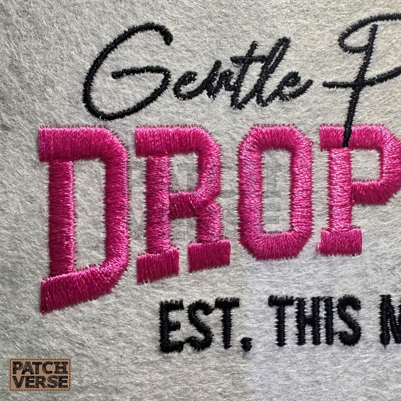 Gentle Parenting Dropout flat embroidery machine design featuring bold varsity lettering with script overlay stitched on a hat hoop setup. Funny mom life cap embroidery file perfect for dad hats, snapbacks and trucker hats. Digital embroidery design available in PES DST EXP VP3 HUS JEF XXX SEW formats for clean professional hat embroidery production..