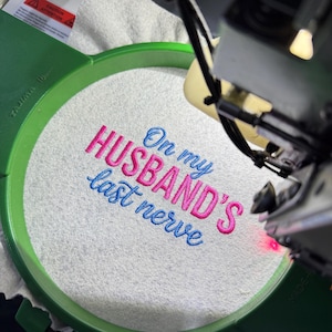 On My Husband’s Last Nerve embroidery design file — professionally digitized machine embroidery pattern for hats, shirts, and sweatshirts. Funny and relatable quote design with clean stitches and smooth outlines. Ideal for wife gifts, humorous apparel, or Valentine’s embroidery projects. Compatible with DST, PES, EXP, JEF, and HUS formats for instant digital download and perfect stitching results.