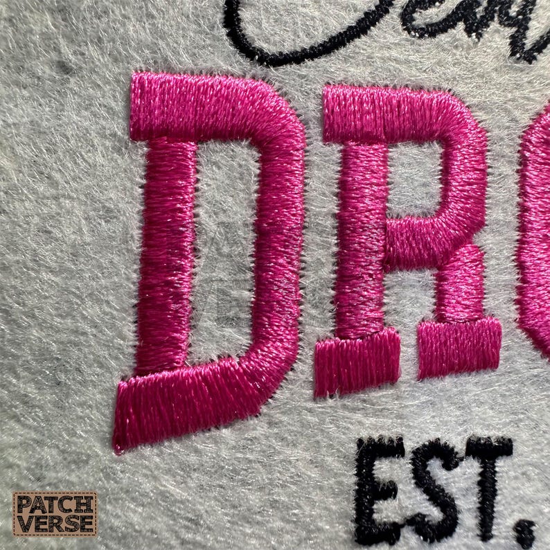 Gentle Parenting Dropout flat embroidery machine design featuring bold varsity lettering with script overlay stitched on a hat hoop setup. Funny mom life cap embroidery file perfect for dad hats, snapbacks and trucker hats. Digital embroidery design available in PES DST EXP VP3 HUS JEF XXX SEW formats for clean professional hat embroidery production..