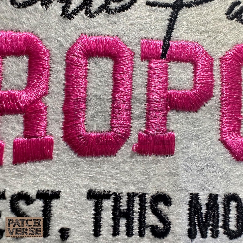 Gentle Parenting Dropout flat embroidery machine design featuring bold varsity lettering with script overlay stitched on a hat hoop setup. Funny mom life cap embroidery file perfect for dad hats, snapbacks and trucker hats. Digital embroidery design available in PES DST EXP VP3 HUS JEF XXX SEW formats for clean professional hat embroidery production..