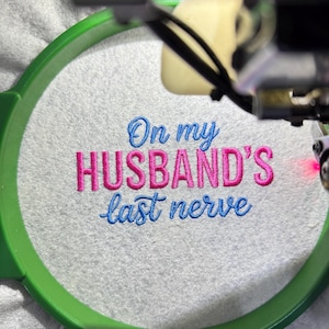On My Husband’s Last Nerve embroidery design file — professionally digitized machine embroidery pattern for hats, shirts, and sweatshirts. Funny and relatable quote design with clean stitches and smooth outlines. Ideal for wife gifts, humorous apparel, or Valentine’s embroidery projects. Compatible with DST, PES, EXP, JEF, and HUS formats for instant digital download and perfect stitching results.