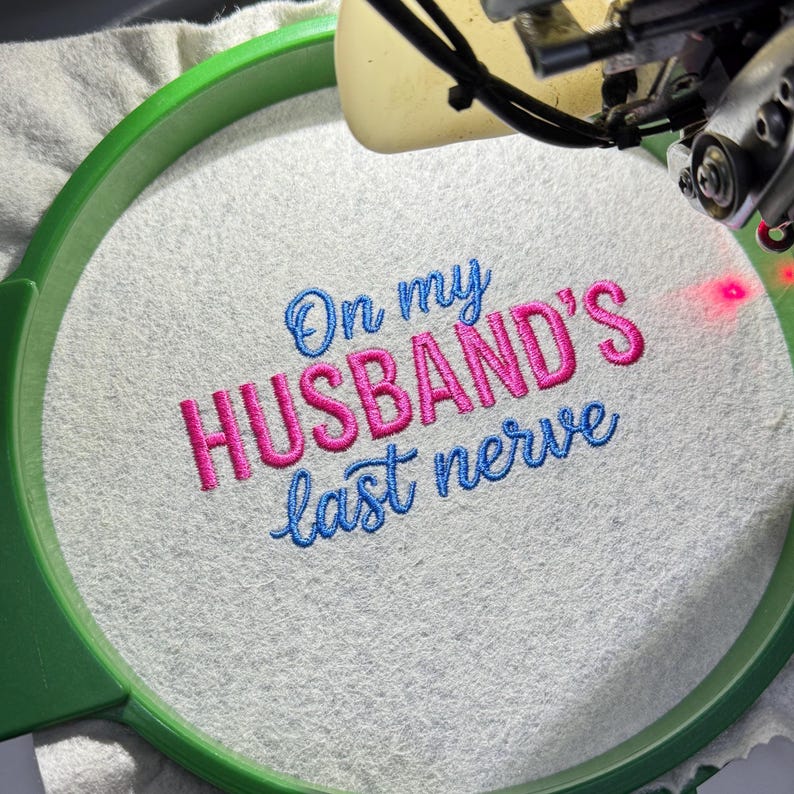On My Husband’s Last Nerve embroidery design file — professionally digitized machine embroidery pattern for hats, shirts, and sweatshirts. Funny and relatable quote design with clean stitches and smooth outlines. Ideal for wife gifts, humorous apparel, or Valentine’s embroidery projects. Compatible with DST, PES, EXP, JEF, and HUS formats for instant digital download and perfect stitching results.