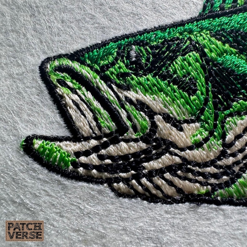Bass fish embroidery design file stitched in a realistic largemouth bass style, professionally digitized for hats and caps. This fishing embroidery file is optimized for dad hats, trucker hats, and snapback caps, featuring clean outlines and smooth fills for outdoor, angler, and fishing brand projects. Perfect for machine embroidery on fishing hats, custom caps, and 
outdoor apparel.