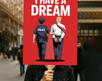 May include: A red sign with the words "I HAVE A DREAM" in white. The sign depicts a cartoon image of a police officer escorting a man in handcuffs. The man is wearing a white shirt and red tie.