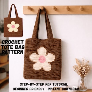 Peut inclure: Un sac fourre-tout au crochet marron avec une grande fleur blanche et rose. Le sac a deux anses et le texte "CROCHET TOTE BAG PATTERN" est visible. Le texte "STEP-BY-STEP PDF TUTORIAL BEGINNER FRIENDLY . INSTANT DOWNLOAD" est également visible.
