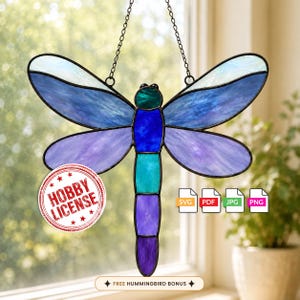 May include: A stained glass dragonfly suncatcher featuring blue, purple, and teal glass segments with black metal framing. A circular red stamp reads HOBBY LICENSE. Four white icons labeled SVG, PDF, JPG, and PNG are present with a text banner below.