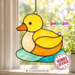May include: A stained glass suncatcher shaped like a yellow duck with an orange beak, resting on a blue water base. The design includes icons for SVG, PDF, JPG, and PNG file formats, a red Hobby License seal, and text reading Free Hummingbird Bonus.
