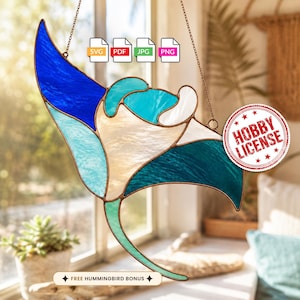 May include: A stained glass manta ray suncatcher featuring blue, teal, and white glass segments with copper foil edges. The image includes file format icons for SVG, PDF, JPG, and PNG, a red circular Hobby License stamp, and text reading FREE HUMMINGBIRD BONUS.