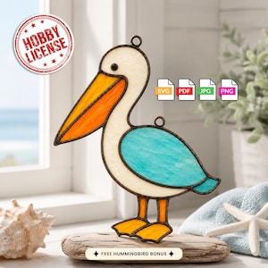 May include: A stained glass pelican ornament featuring a white body, a bright orange beak, and a turquoise wing. The piece has dark metal outlines and a small hanging loop at the top. Text on the image includes HOBBY LICENSE, SVG, PDF, JPG, PNG.