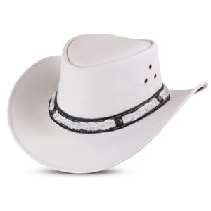 May include: A white leather cowboy hat with a braided band and black stitching. The hat has a wide brim and a tall crown.