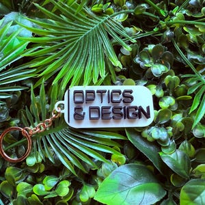 Optics & Design Keychain –  TV Show Collectible – Key Chain prop