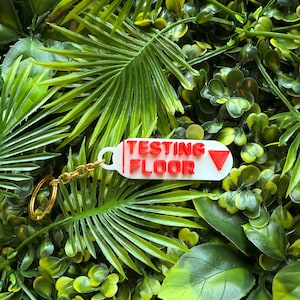 Testing floor Keychain - TV Show Prop – Red Down Elevator Arrow – Collectible - Key Chain