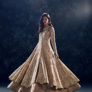 gold nikkah dress Ice Blue Nikkah Dress Step into a dreamlike moment with our Ice Blue Nikkah Dress! This ethereal beauty is a symphony of softness and grace, designed to make your special day unforgettable