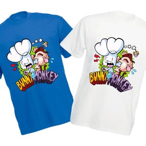 May include: Two t-shirts featuring a cartoon graphic of a bunny and a monkey. The bunny is wearing a chef's hat and the monkey is crying. The text "Bunny vs Monkey" is written in a colourful, graffiti-style font.