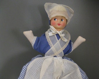 Vintage 1950's Hand Made Toaster Cover Doll. Measures About 18" T.Has Celluloid Face, Wood Base. Blue Gingham Dress, White Apron. Few Stains