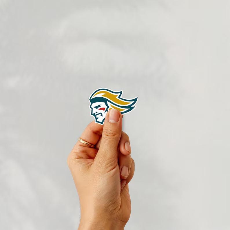 Holding a sticker of belfast giants ice hockey team logo on a white background