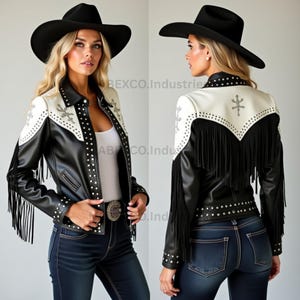 May include: Black and white leather jacket with fringe and studded details. The jacket has a white yoke with embroidered accents and a black collar. A black cowboy hat completes the look. The jacket is worn with blue jeans.