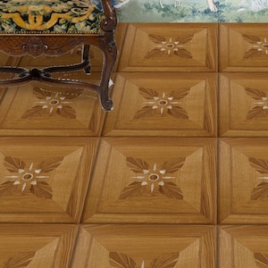May include: Close-up of a wooden parquet floor with a repeating pattern. Each square features a central floral design with light and dark brown accents. The floorboards are arranged in a grid, creating a visually appealing surface.