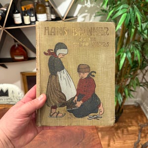 Antiquités c. 1910 Hans Brinker ou les patins d'argent relié livre pour enfants illustré - livre de contes pour enfants à couverture rigide vintage des années 1900
