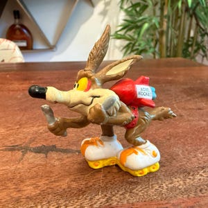 Vintage c. 1988 Wyle E. Coyote with ACME Rocket Hard Rubber Figurine Toy by Applause for Warner Bros. - Retro 1980's Toddler Toy Figurine