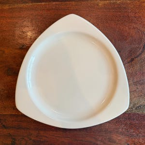 May include: A rustic wooden sign with the text "Welcome to our home" in white lettering. The sign features a distressed finish and a simple, inviting design, perfect for entryway decor.