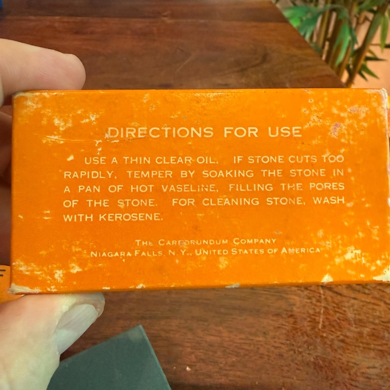 May include: An orange box with the text "DIRECTIONS FOR USE" and instructions for use. The box also includes the company name and location: The Carborundum Company, Niagara Falls, N. Y., United States of America.