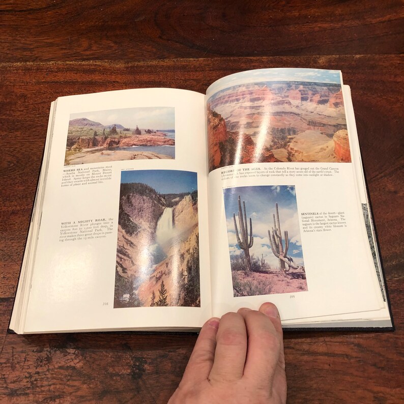 May include: An open book with two pages showing colourful images of natural landscapes. The left page shows a waterfall cascading down a rocky cliff, while the right page features a view of a canyon with a river winding through it. The text on the left page reads "With a mighty roar, the Yellowstone River plunges 308 feet deep..."